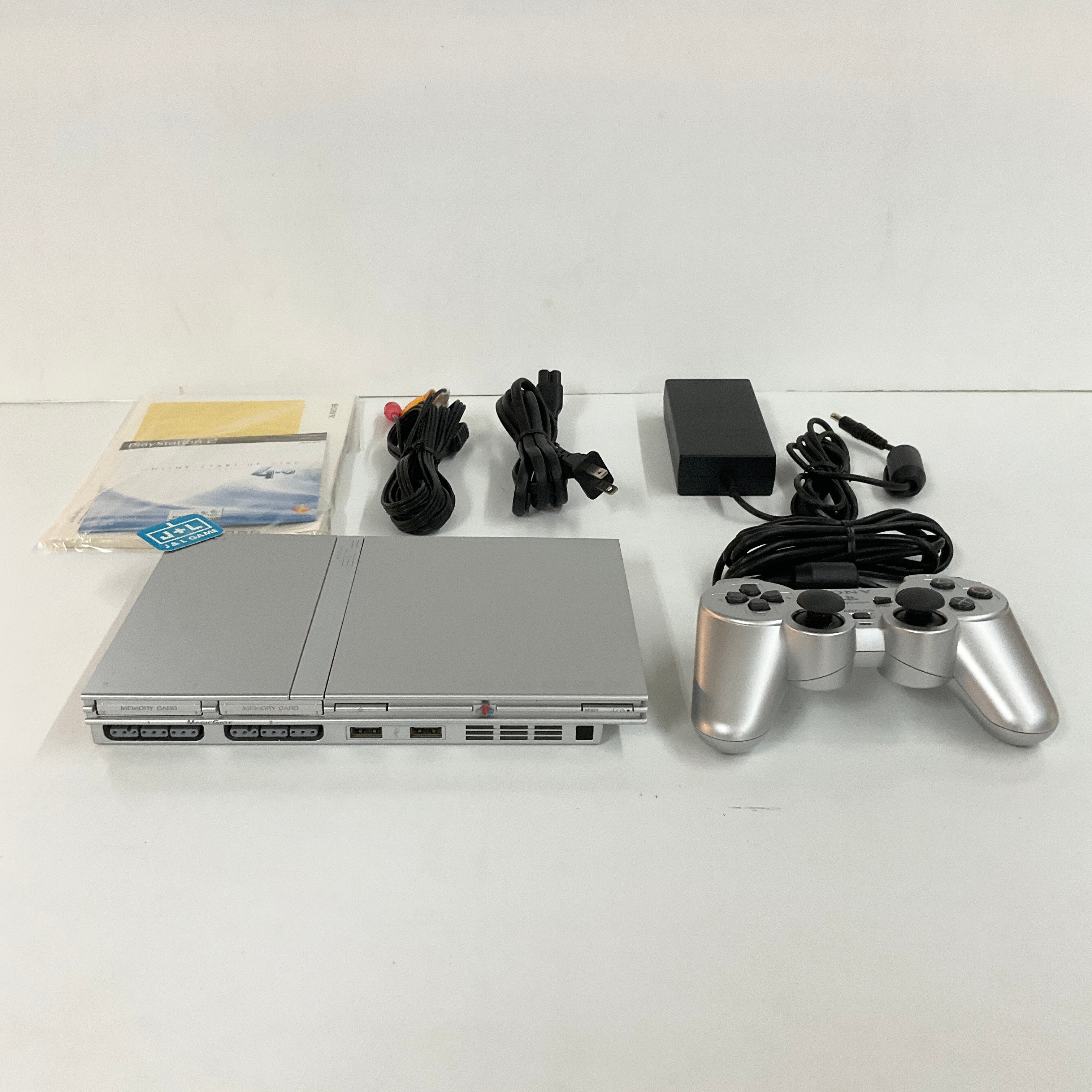 PlayStation 2 Slim Console in Silver shops with 2 Memory Cards and games