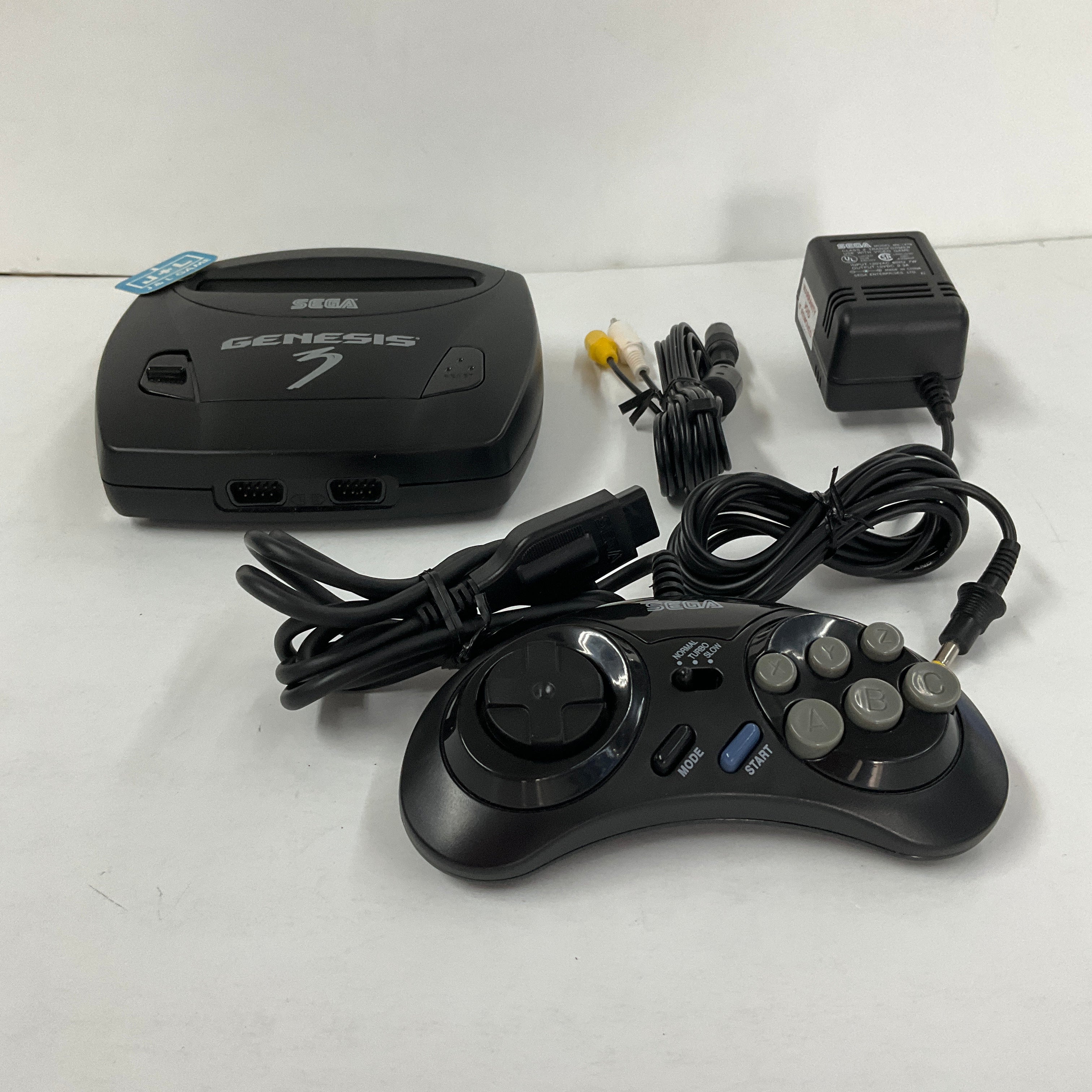 Sega Genesis console with 3 popular games